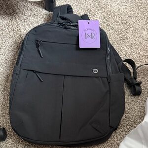 Black iris and rainbow Backpack